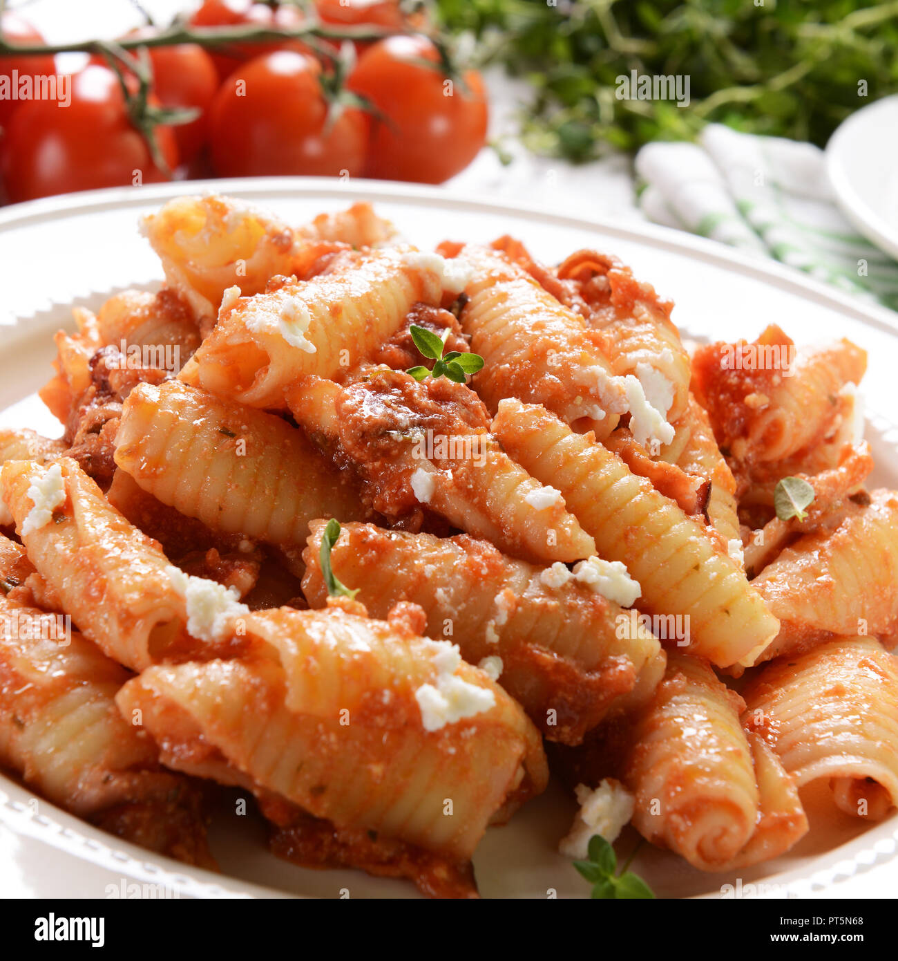 Pasta with ricotta sauce, tomatoes and ham Stock Photo Alamy