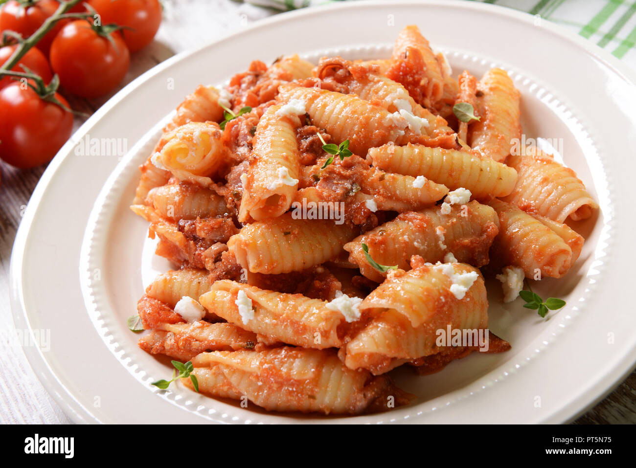 Pasta with ricotta sauce, tomatoes and ham Stock Photo Alamy
