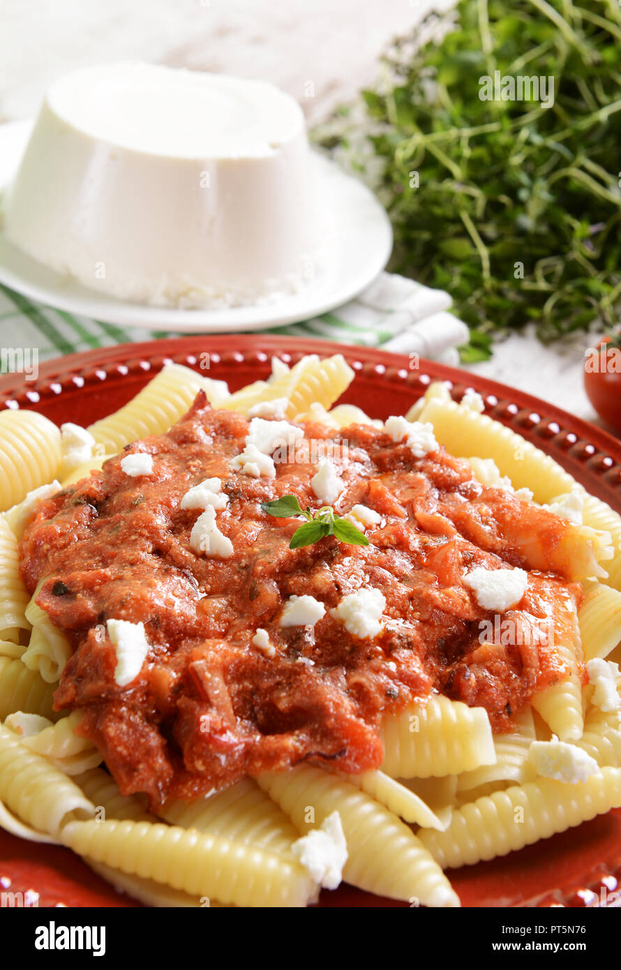 Pasta with ricotta sauce, tomatoes and ham Stock Photo Alamy