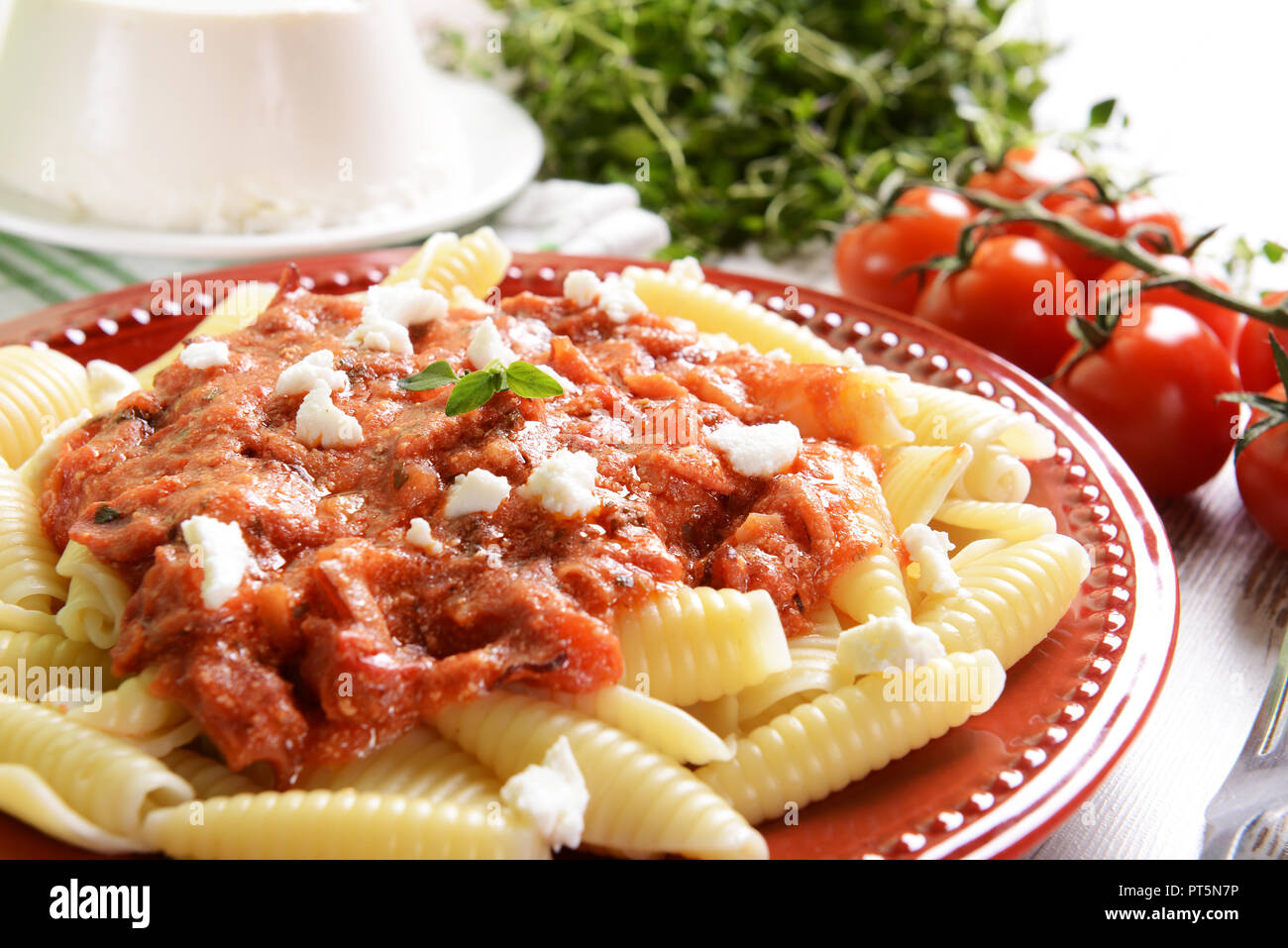 Pasta with ricotta sauce, tomatoes and ham Stock Photo Alamy