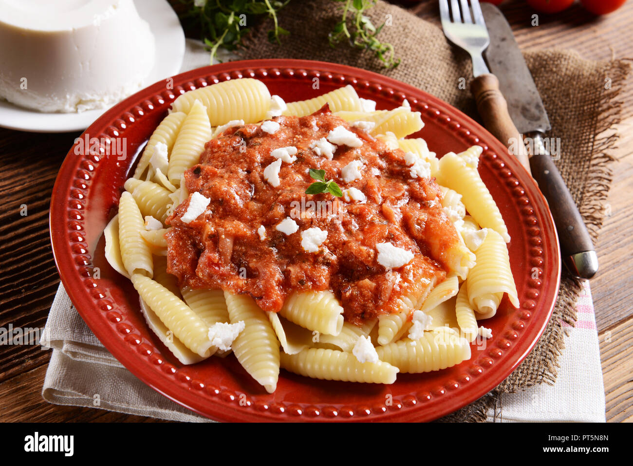 Pasta with ricotta sauce, tomatoes and ham Stock Photo Alamy