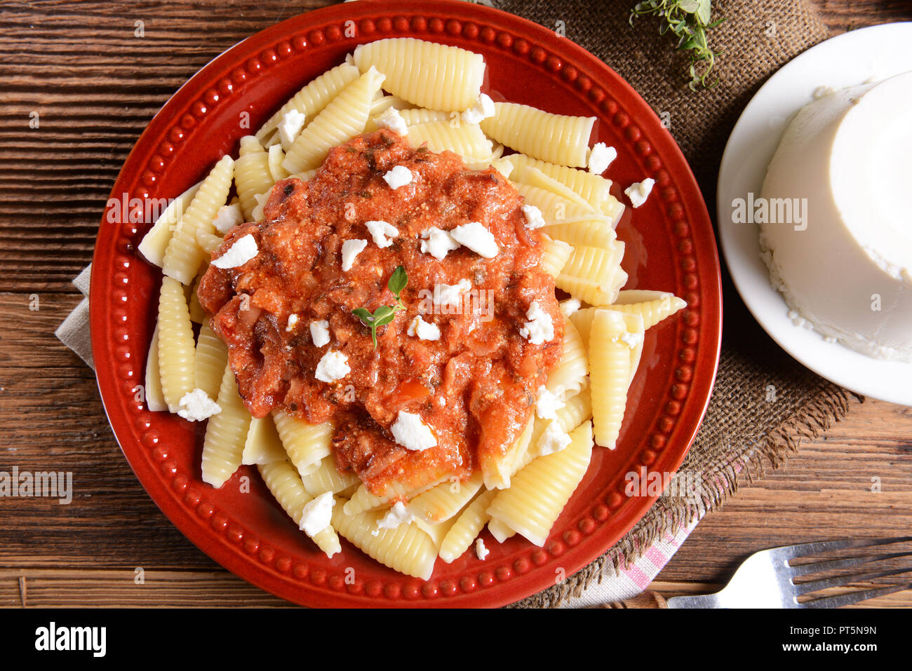 Pasta with ricotta sauce, tomatoes and ham Stock Photo Alamy