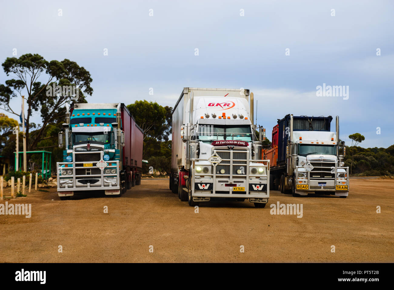 road trains parking next to each other, one is about to start driving, Madura, Western Australia, Australia Stock Photo