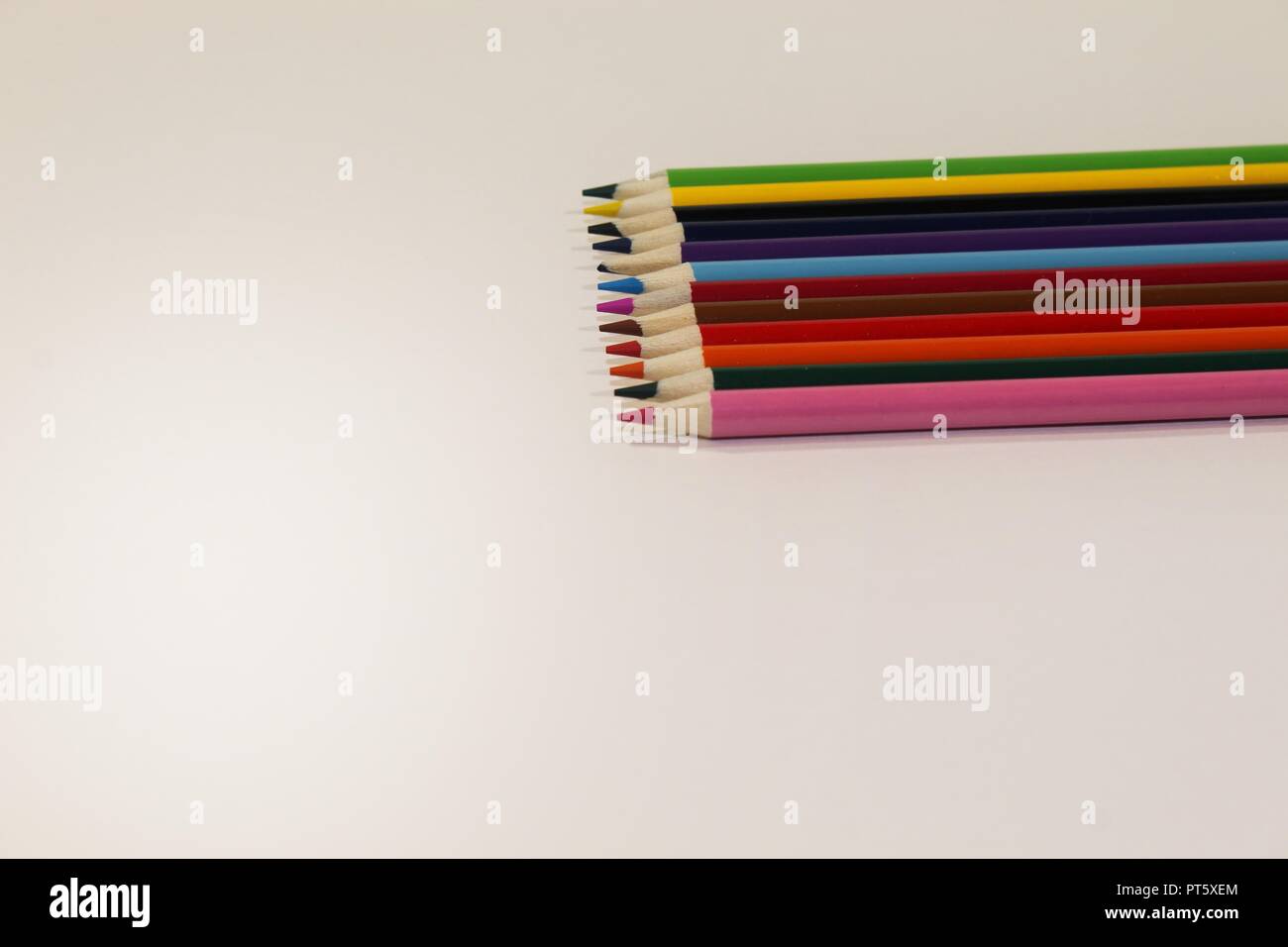 Colored Pencils straight together on the right side of the frame Stock