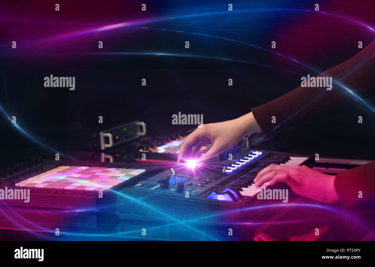 Hand mixing music on midi controller with wave vibe concept Stock Photo