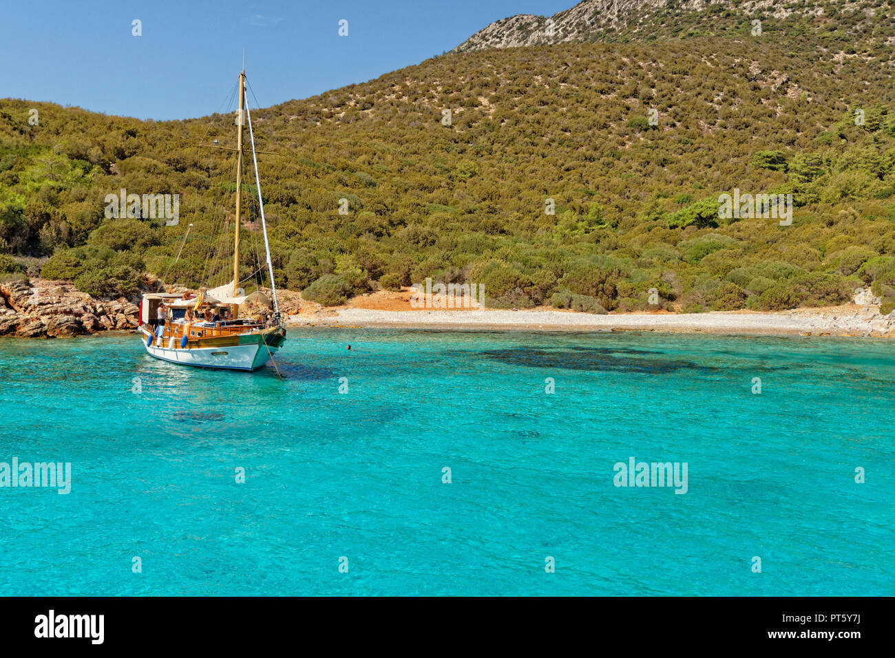 Gulet cruise boat moored at Poyraz bay on the island Karaada (Black Island) near Bodrum in Mugla Province, Turkey. Stock Photo