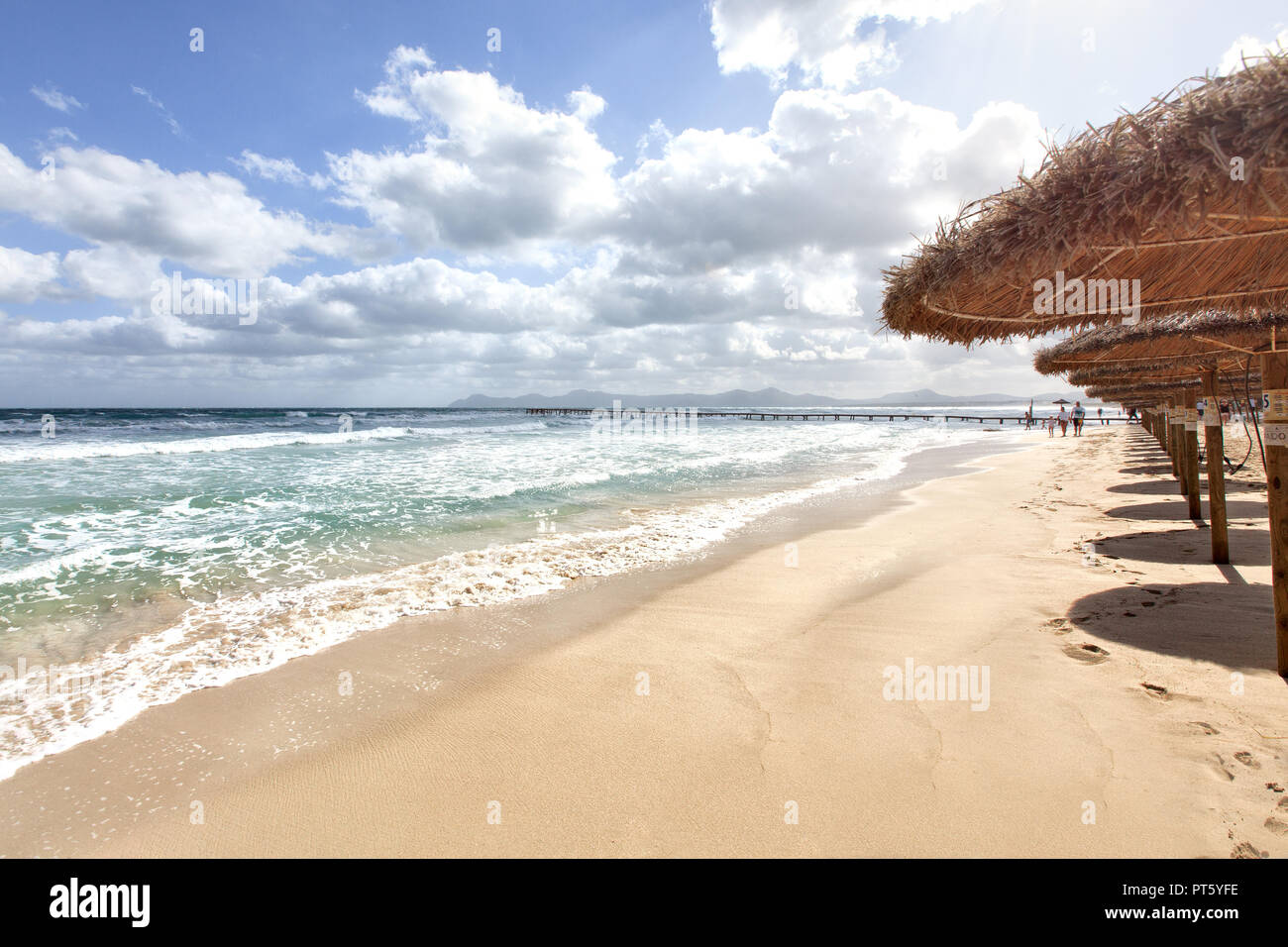 Europe Spain North Mallorca Playa de Muro, long wooden jetty in the bay of Alcudia during violent storm Stock Photo