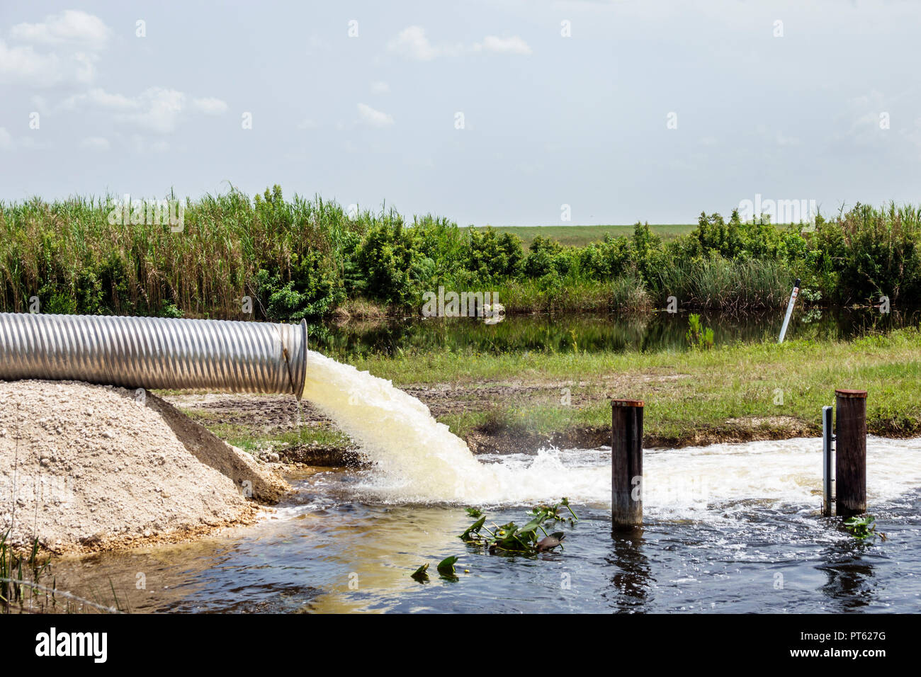 Miami Florida,Everglades National Park,under new construction site building builder,steel aluminum water release pipe,pump out outfall drainage,galvan Stock Photo
