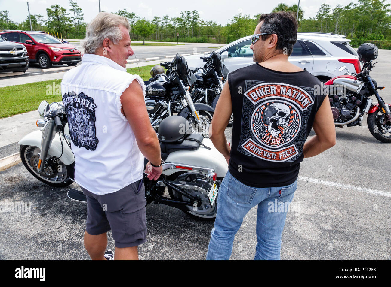 Florida,Everglades,Big Cypress National Preserve,adult adults man men  male,friends,motorcycle motorcycles club members,patches,motorcycles,Oasis  Visit Stock Photo - Alamy