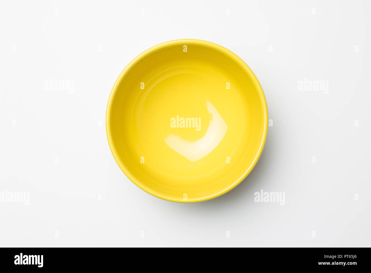 Yellow bowl on white background Stock Photo
