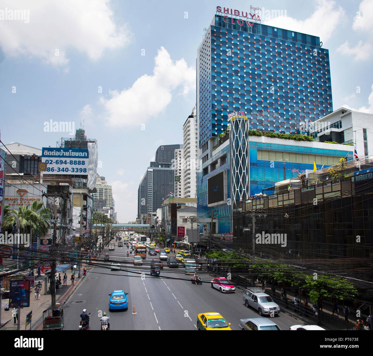 Thai people drive and ride on Petchaburi Road with traffic jam near Pratunam Market and Platinum Fashion Mall at Bangkok city on April 24, 2018 in Ban Stock Photo