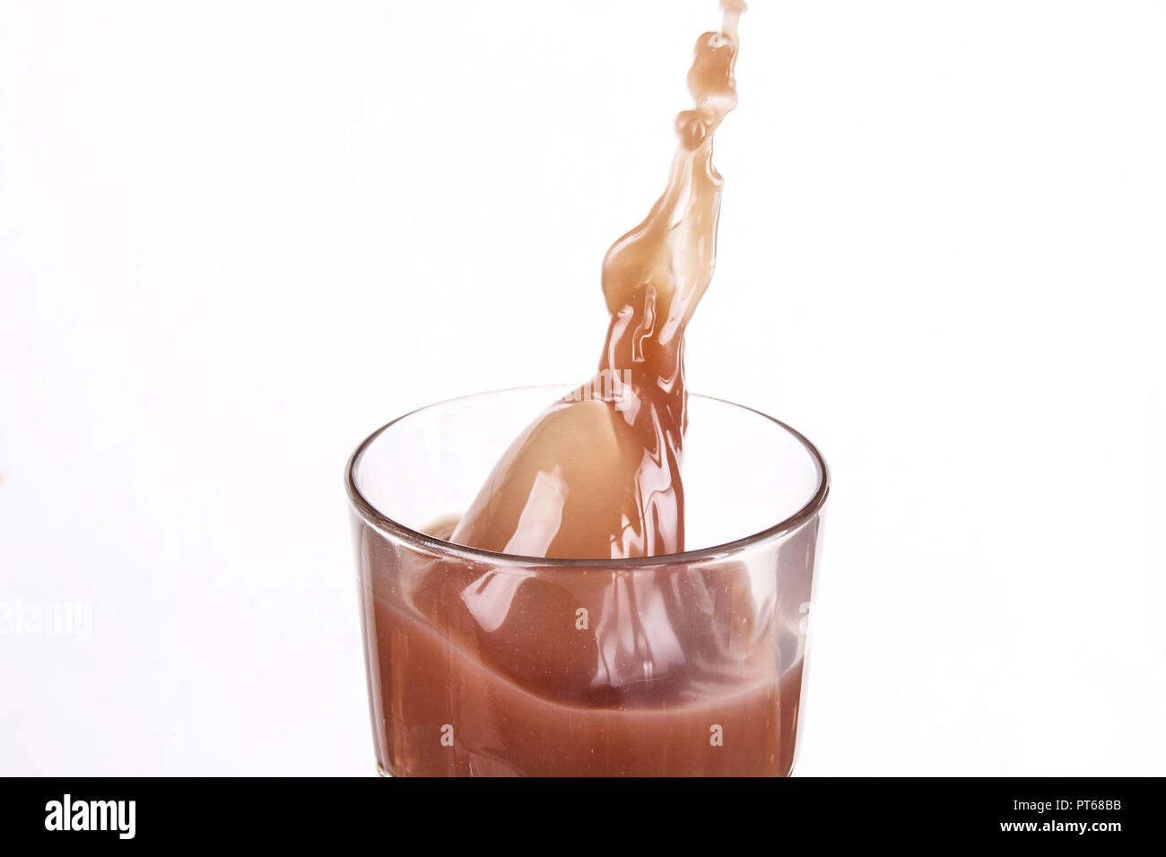 Chocolate Drink Splashing in a Drinking glass Stock Photo