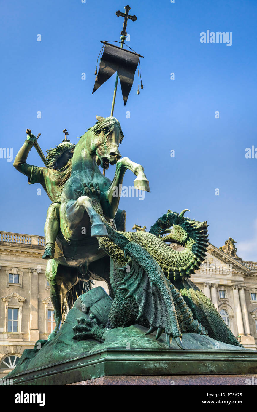 St. George and the Dragon Statue, by sculptor August Kiss, is situated next to the River Spree facing St. Nicholas Church, the oldest church in the ci Stock Photo