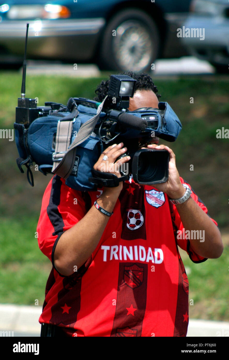 TV cameraman filming a news event Stock Photo