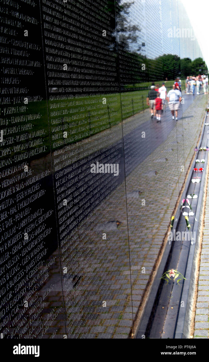 The Vietnam War Memorial Wall relecting visitors in Washington, DC Stock Photo