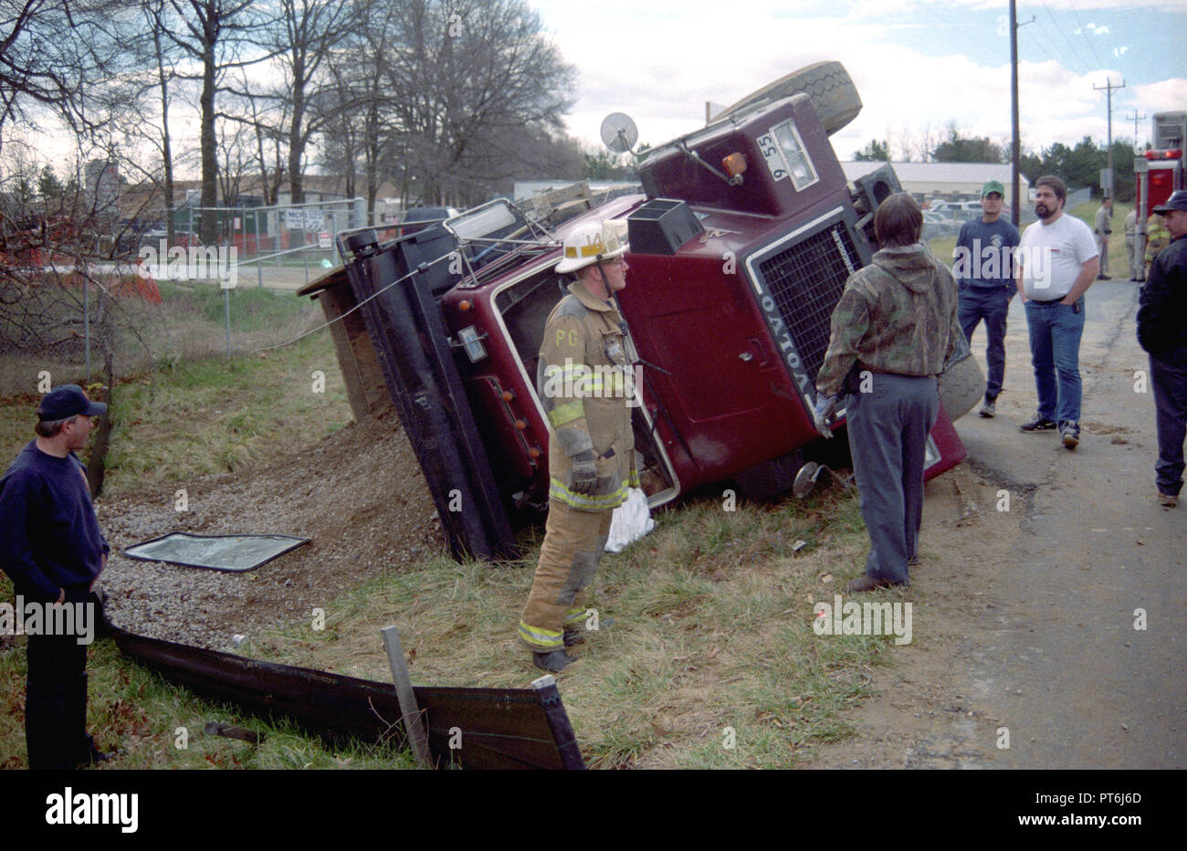 Firefighters examine an overturned tractor trailer in Largo, Maryland Stock Photo