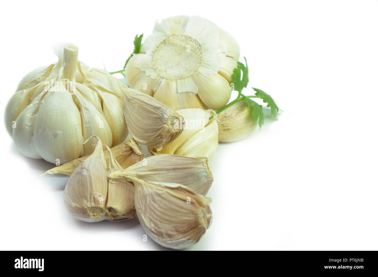 Isolated garlic and clove on white background Stock Photo - Alamy