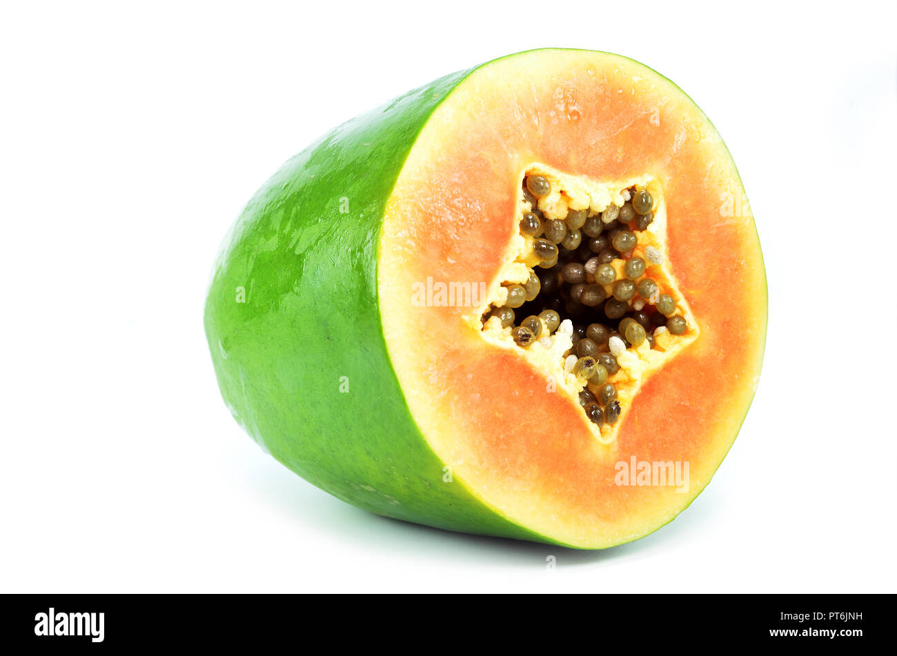 Green papaya top view with seeds and orange flesh Stock Photo