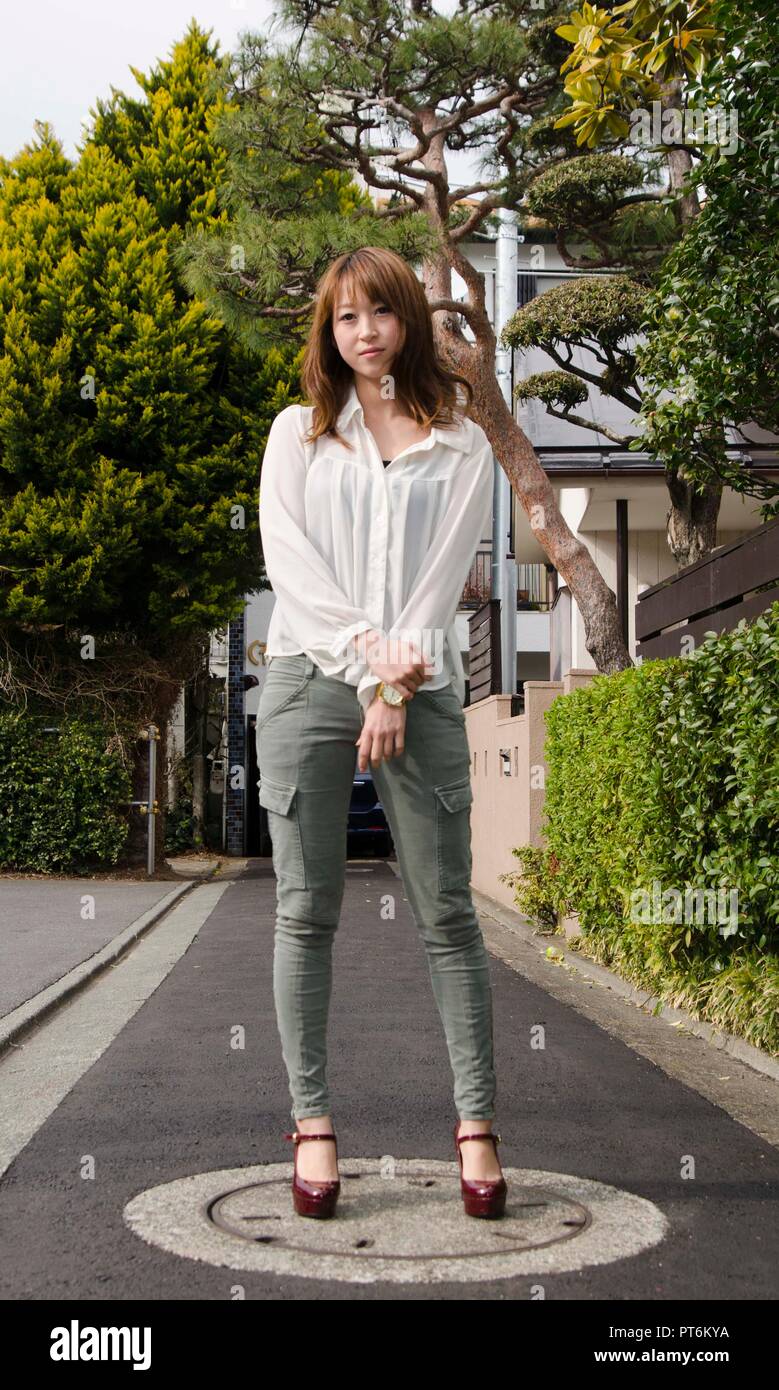 Japanese Girl poses on the street in Jiyugaoka, Japan. Jiyugaoka is a ...