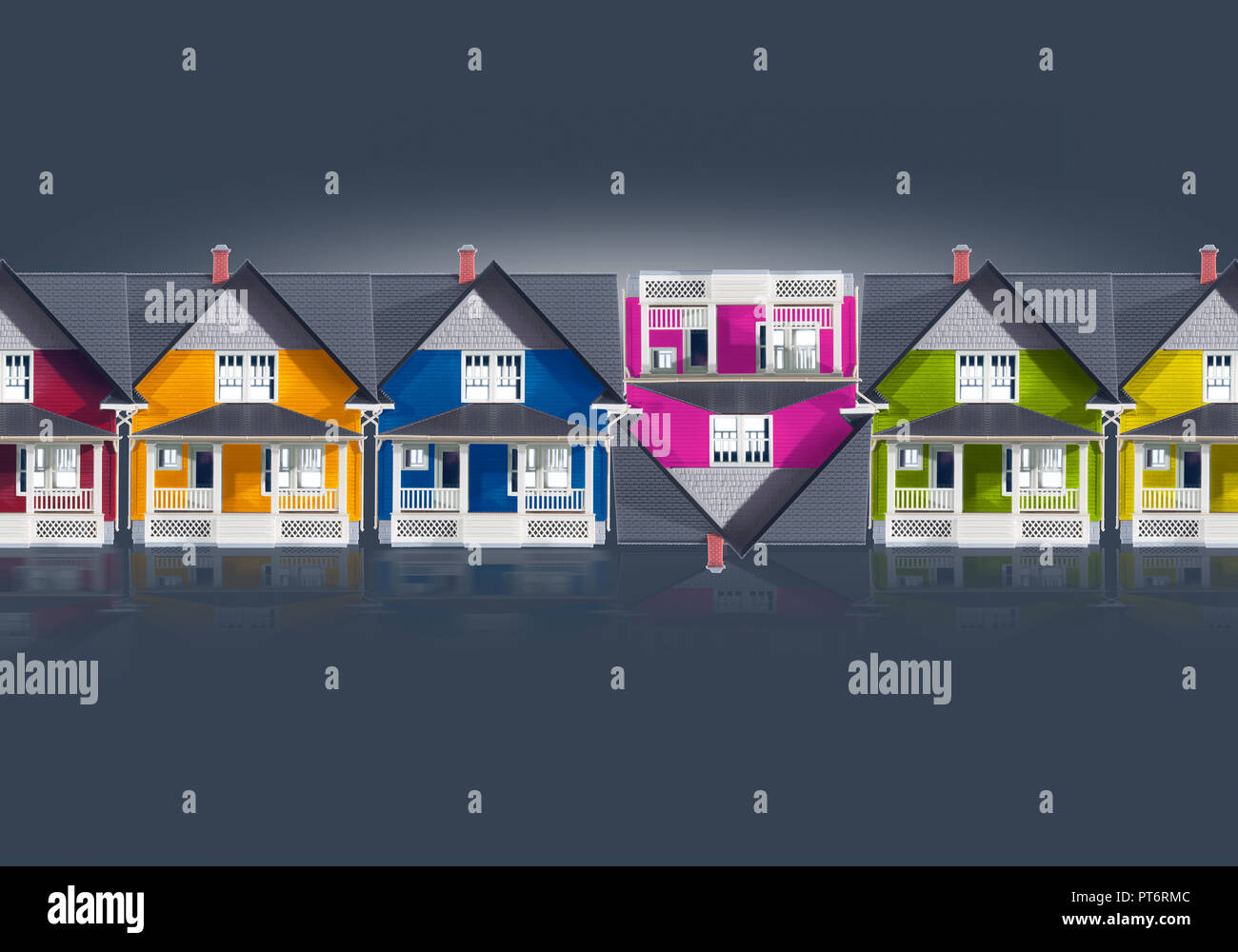 Concept A row of Color Houses Simulating Up Down Arrows, House Markets, Real Estate, Financial, Mortgage Equity Stock Photo