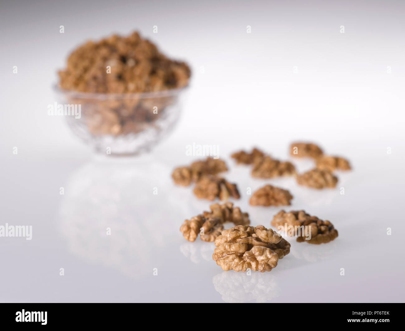 a still life of walnuts against a plain background Stock Photo Alamy