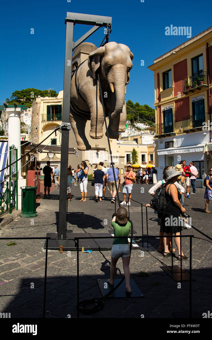 statue of a small girl lifting an elephant with a rope on the isle of capri  Stock Photo - Alamy