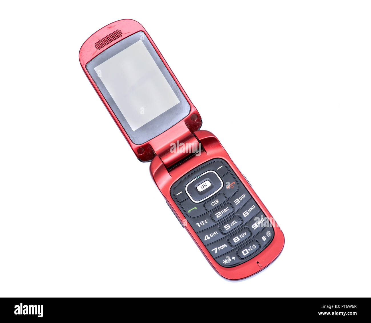 Old used flip cell phone isolated on white background Stock Photo - Alamy