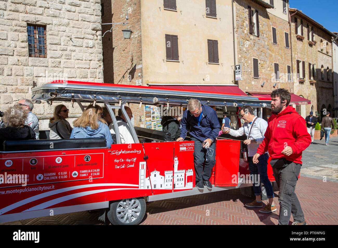 Tourists in Montepulciano an historic Italian hilltop town in Tuscany on a sightseeing tour bus of Montepulciano Stock Photo