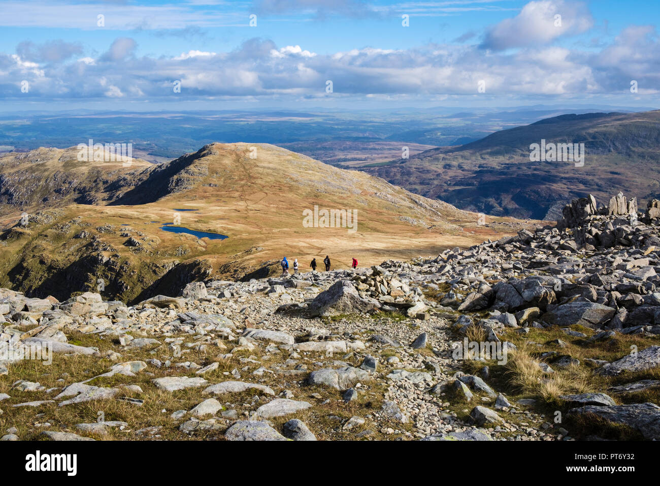 Stony path on descent from Glyder Fach mountain towards Foel Goch and Llyn Caseg-fraith in mountains of Snowdonia National Park. North Wales UK Stock Photo