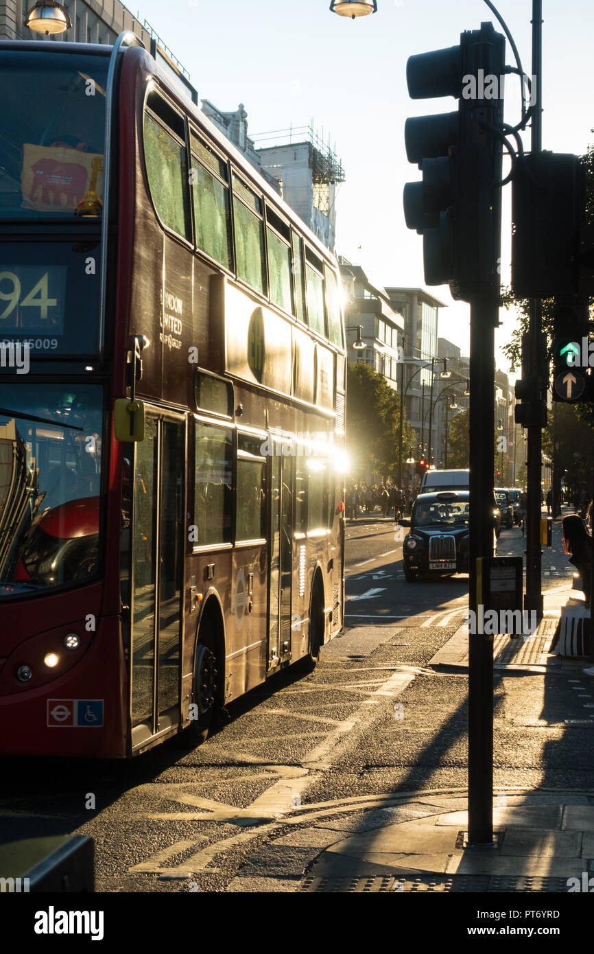 Contre jour image of a Red London Bus on Oxford street, London UK, Europe Stock Photo