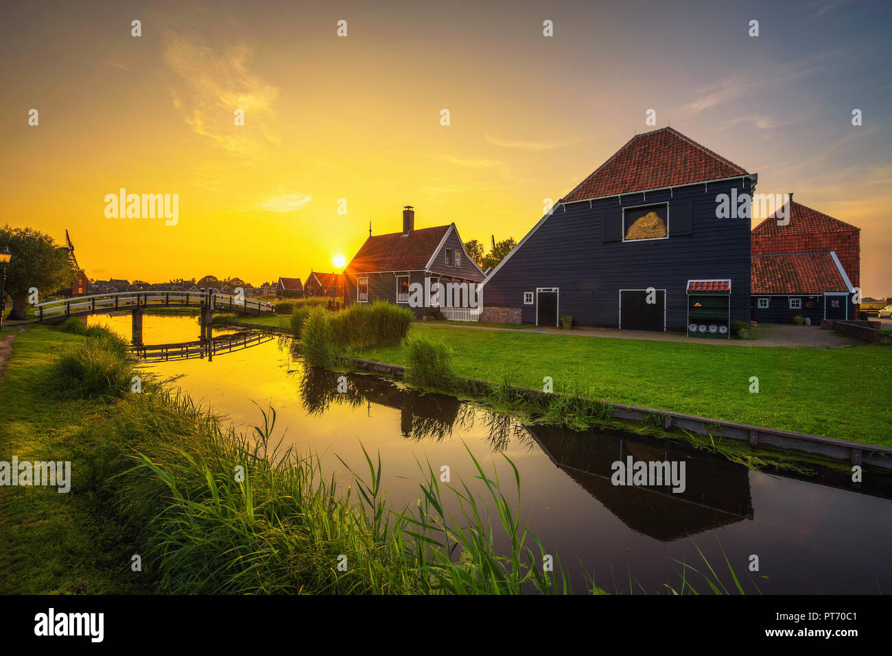 Sunset above the village of Zaanse Schans in the Netherlands Stock Photo