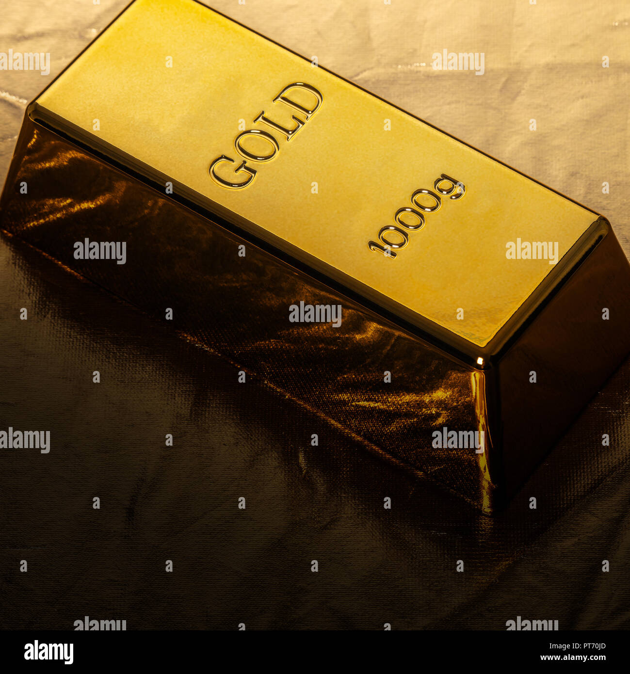 bar of gold closeup on golden background Stock Photo Alamy