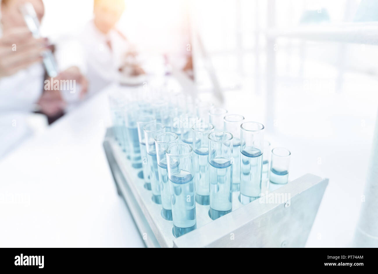 Scientists look closely at the test tube in the laboratory Stock Photo ...