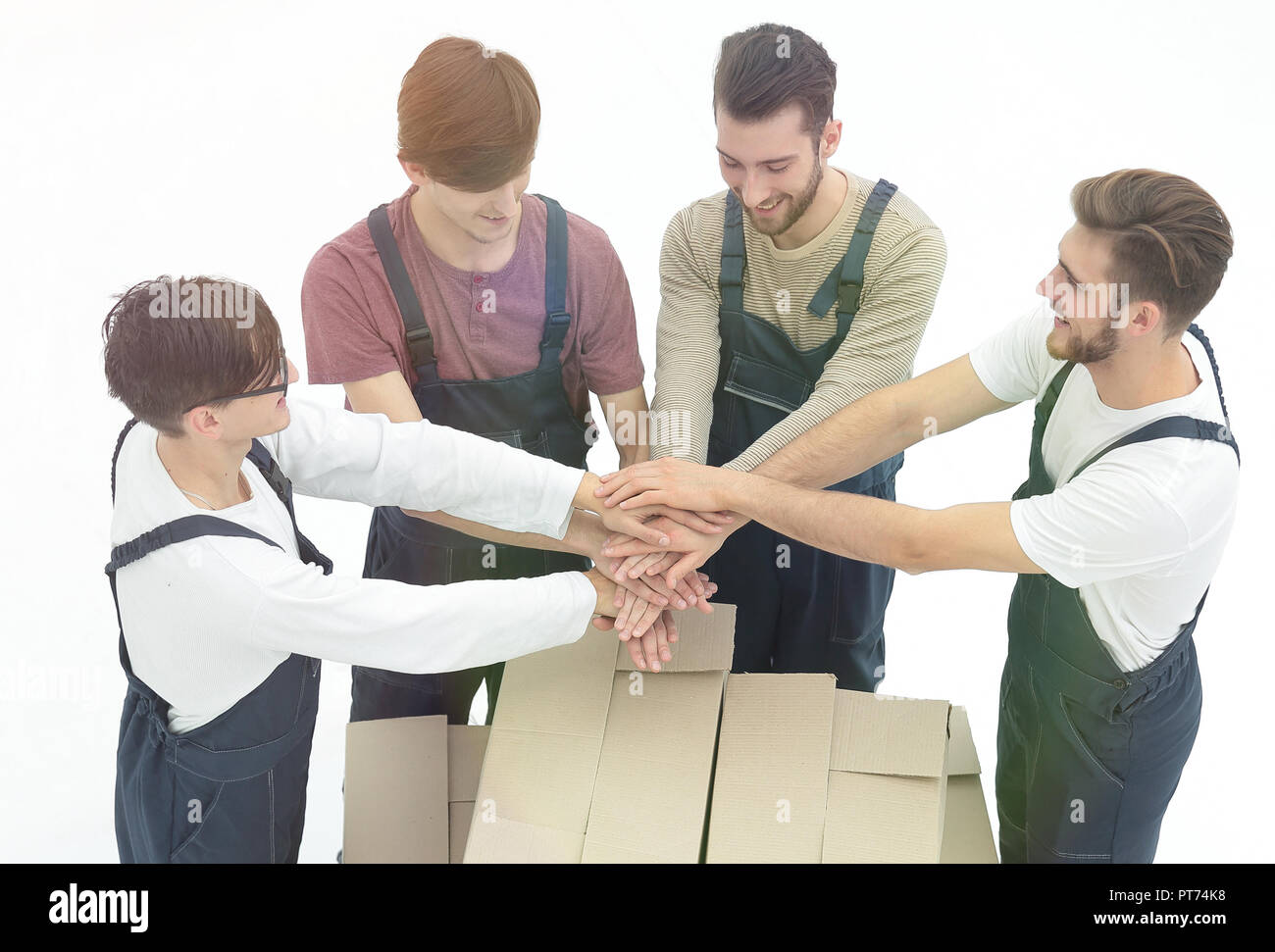 Young movers holding boxes. Delivering and transportation concept. Stock Photo