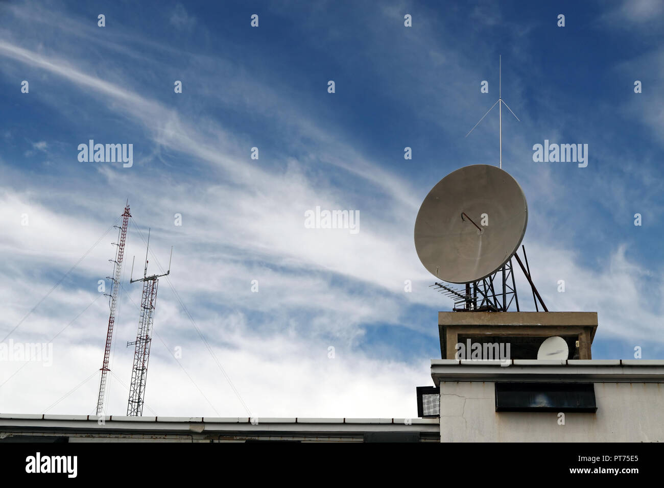 Several kind of communication antennas against deep mountain blue sky