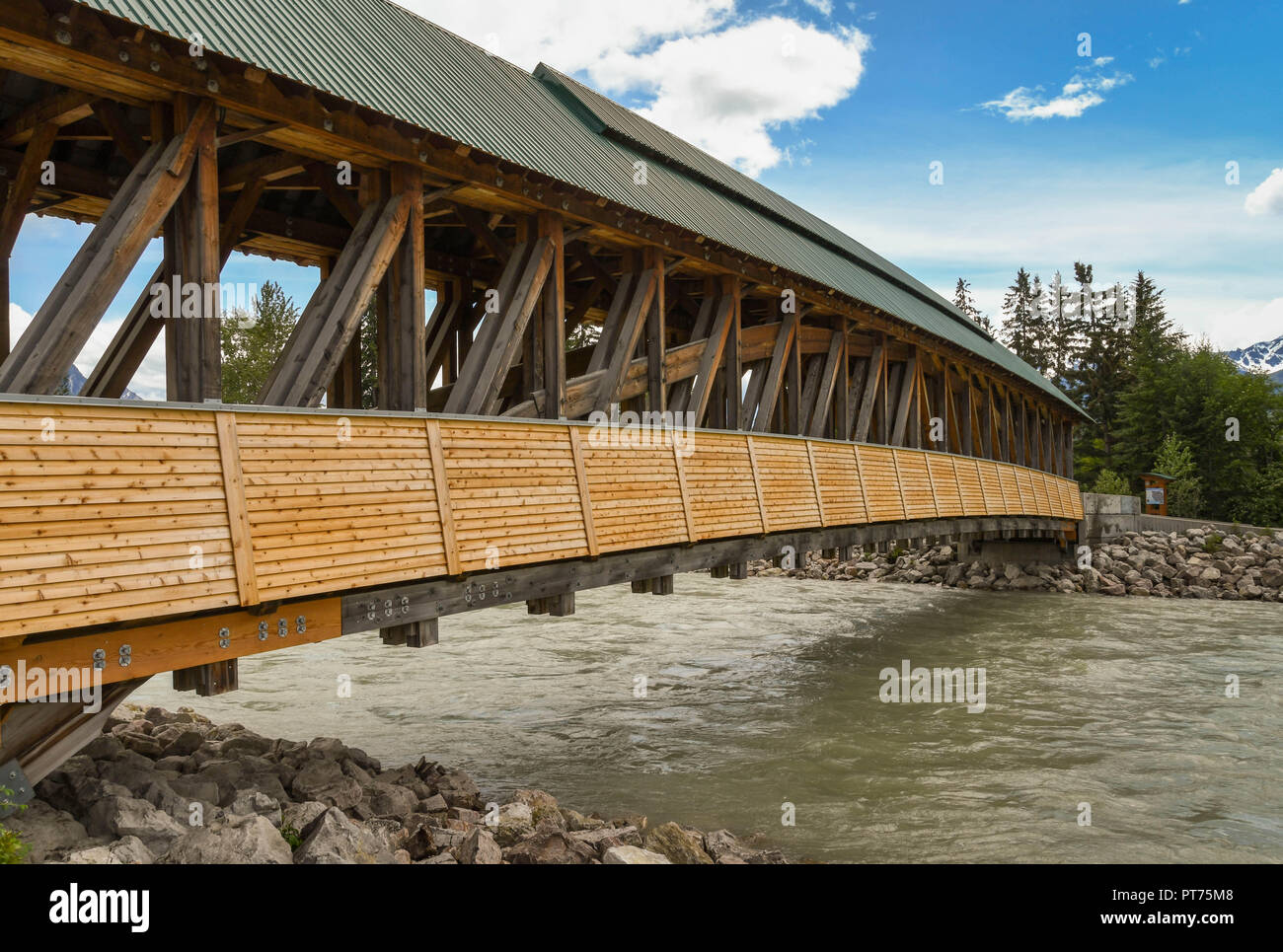 GOLDEN, BRITISH COLUMBIA, CANADA - JUNE 2018: The Kicking Horse pedestrian bridge over the river of the same name in Golden, BC. Stock Photo