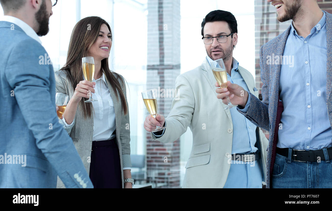 close up.business people raising glasses with wine. Stock Photo