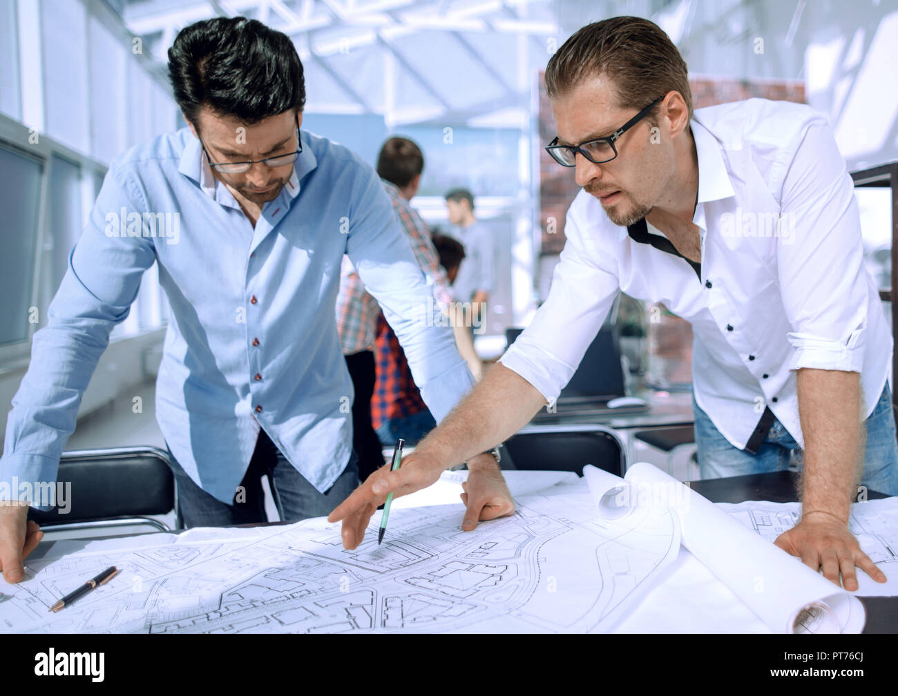 landscape designers discussing new sketches Stock Photo