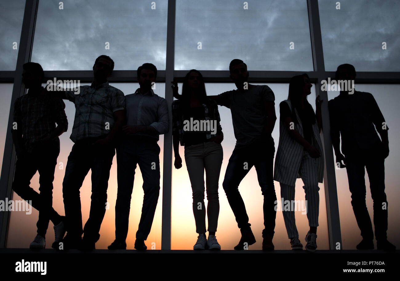 creative business team standing near the office window Stock Photo - Alamy