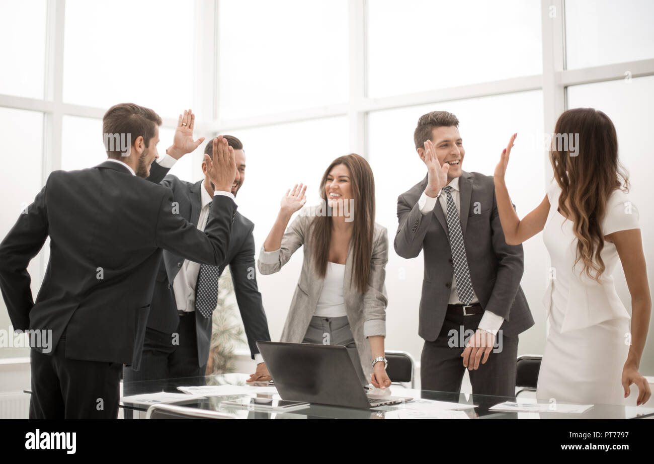 happy business team standing near office Desk Stock Photo - Alamy
