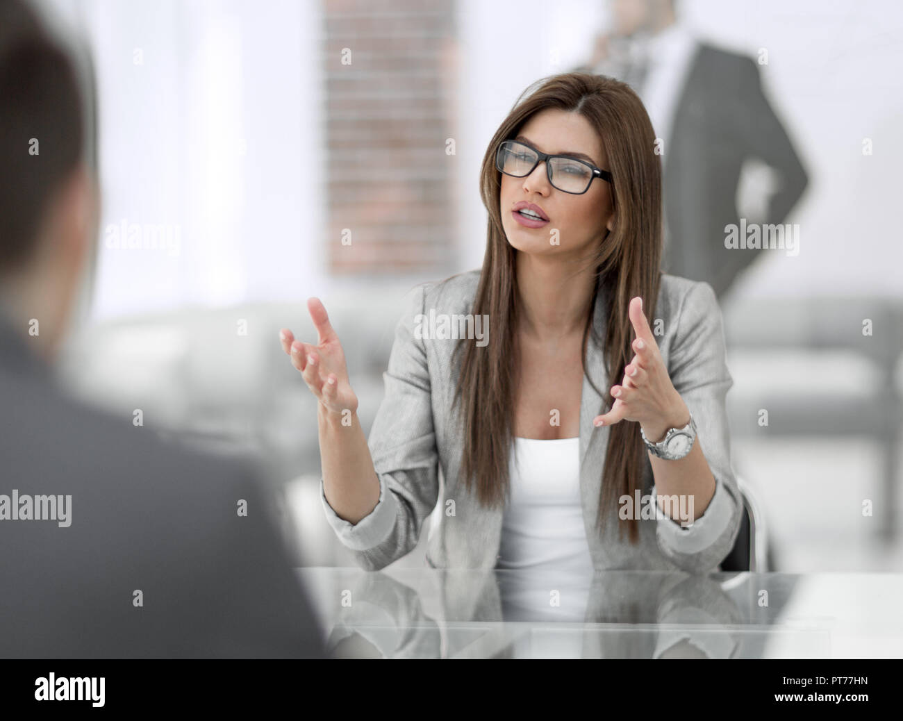 Manager talking with a client in a modern office Stock Photo - Alamy