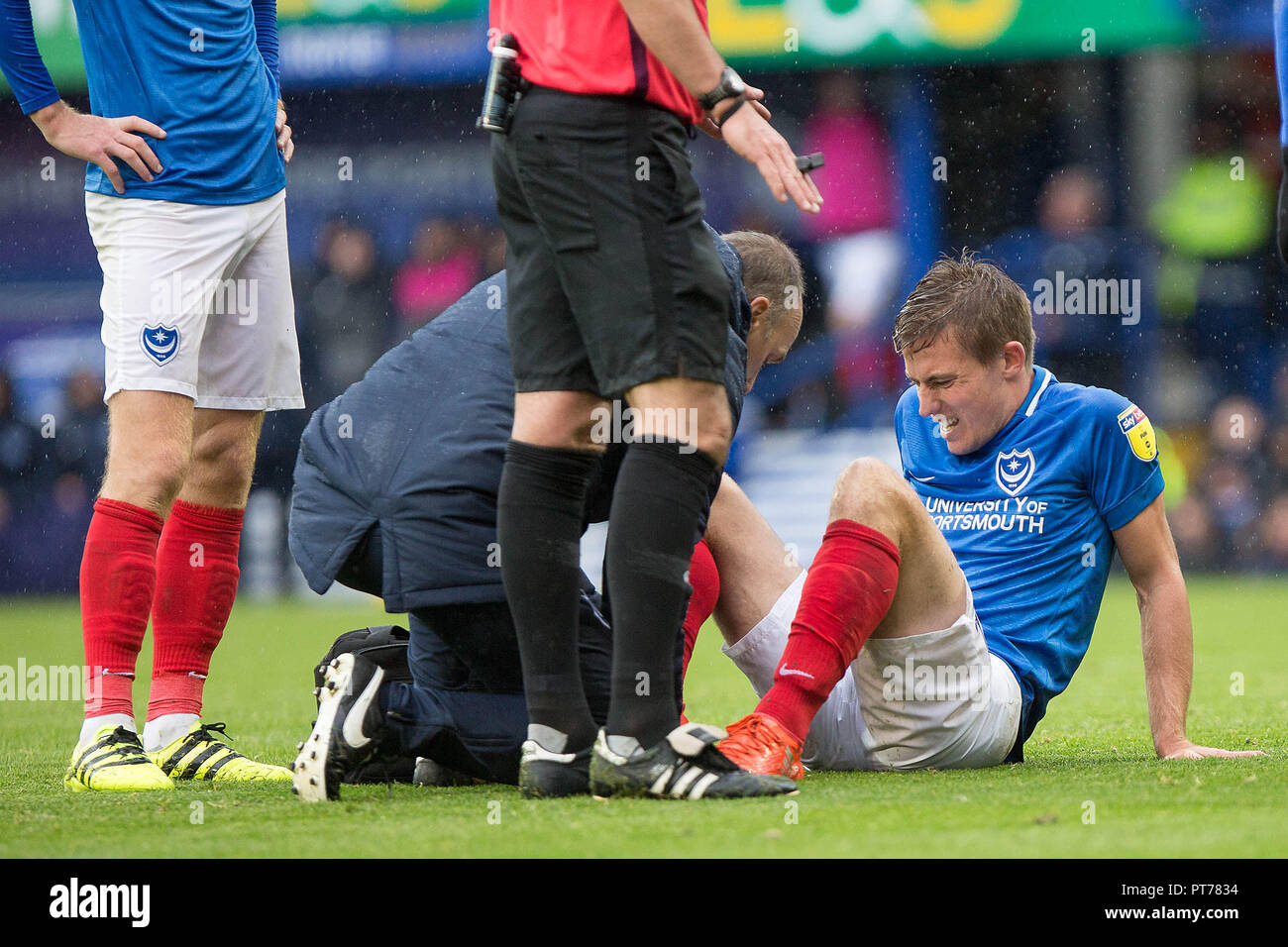Portsmouth, UK. 6th October 2018. David Wheeler of Portsmouth receives treatment during the EFL Sky Bet League 1 match between Portsmouth and Gillingham at Fratton Park, Portsmouth, England on 6 October 2018. Photo by Simon Carlton.  Editorial use only, license required for commercial use. No use in betting, games or a single club/league/player publications. Credit: UK Sports Pics Ltd/Alamy Live News Stock Photo