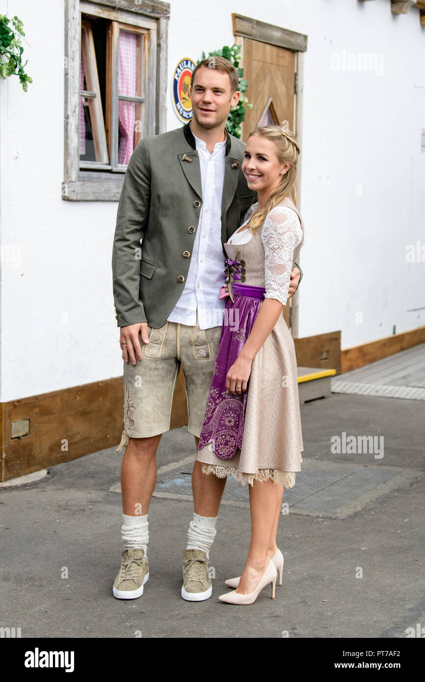 Munich, Bavaria. 07th Oct, 2018. Manuel Neuer and his wife Nina Weiss come to the beetle tent at the Oktoberfest on the Theresienwiese. Players, coaches and managers of the Bundesliga soccer team FC Bayern traditionally visit the Käfer tent together once during the Oktoberfest. Credit: Matthias Balk/dpa/Alamy Live News Stock Photo