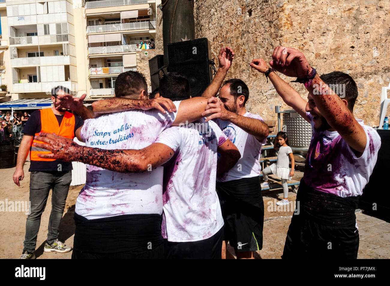 Sitges, Spain. 07th Oct, 2018. 40th Grape Stomping Competition is one of the events held within the traditional 57th harvest festival, which is traditionally celebrated in Sitges, in the Plaza de la Fragata. Joy of the first classified of the Grape Stomping Competition. Credit: Cisco Pelay / Alamy Live News. Stock Photo