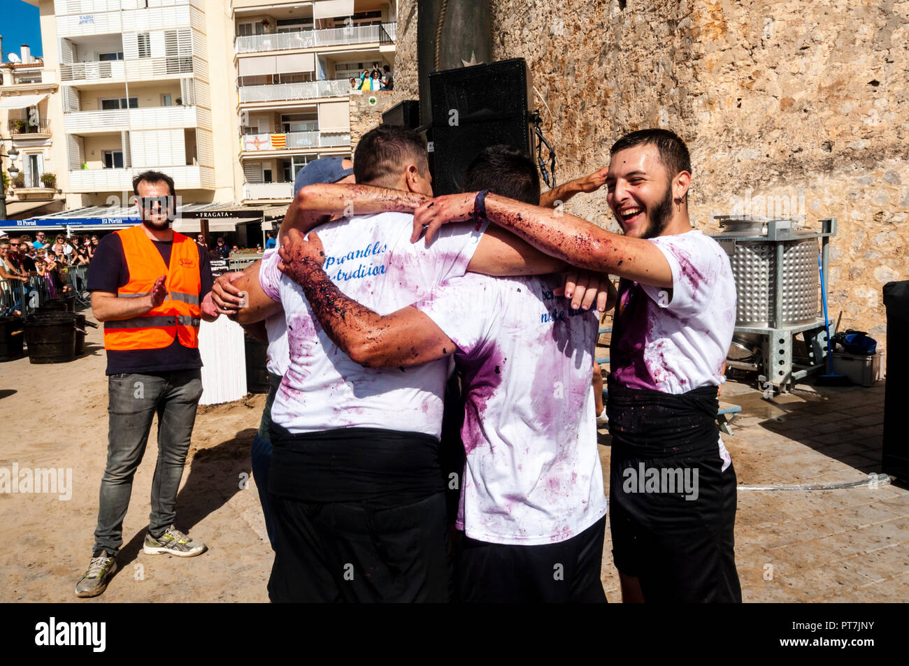 Sitges, Spain. 07th Oct, 2018. 40th Grape Stomping Competition is one of the events held within the traditional 57th harvest festival, which is traditionally celebrated in Sitges, in the Plaza de la Fragata. Joy of the first classified of the Grape Stomping Competition. Credit: Cisco Pelay / Alamy Live News. Stock Photo