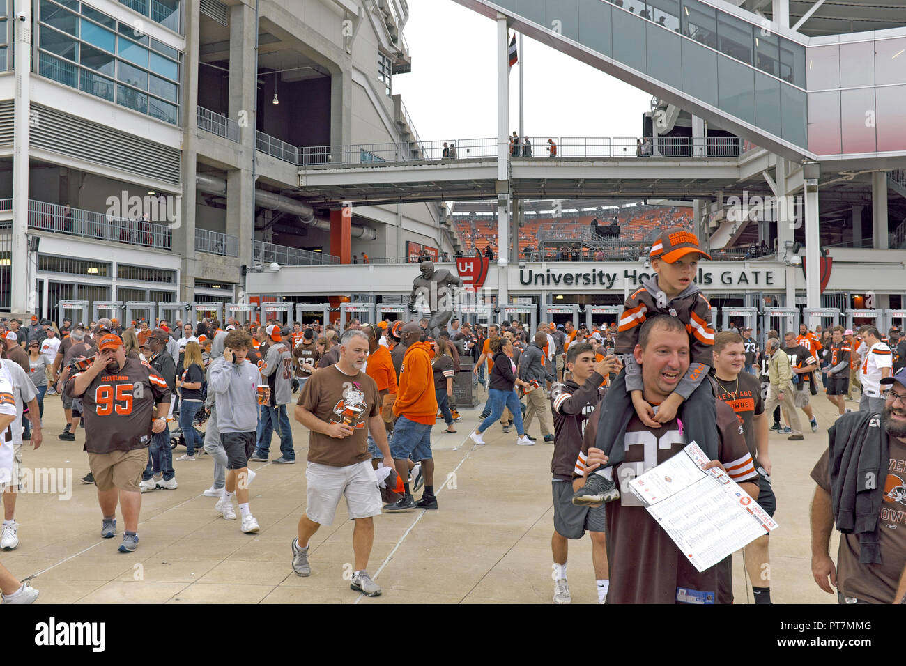 Cleveland, Ohio, USA, 7 Oct, 2018.  Cleveland Browns football fans exit FirstEnergy Stadium in downtown Cleveland, Ohio after an overtime win against the Baltimore Ravens 12-9.  This is the second win for the Cleveland Browns this season.  Credit: Mark Kanning/Alamy Live News. Stock Photo