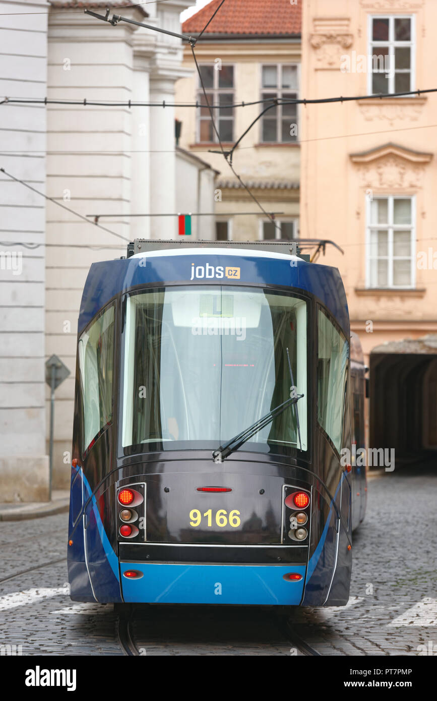Prague, Czech Republic - September 14, 2018: Tram Skoda 14T ForCity on a narrow street in the city center. As of 2017, the Prague tram network is the  Stock Photo