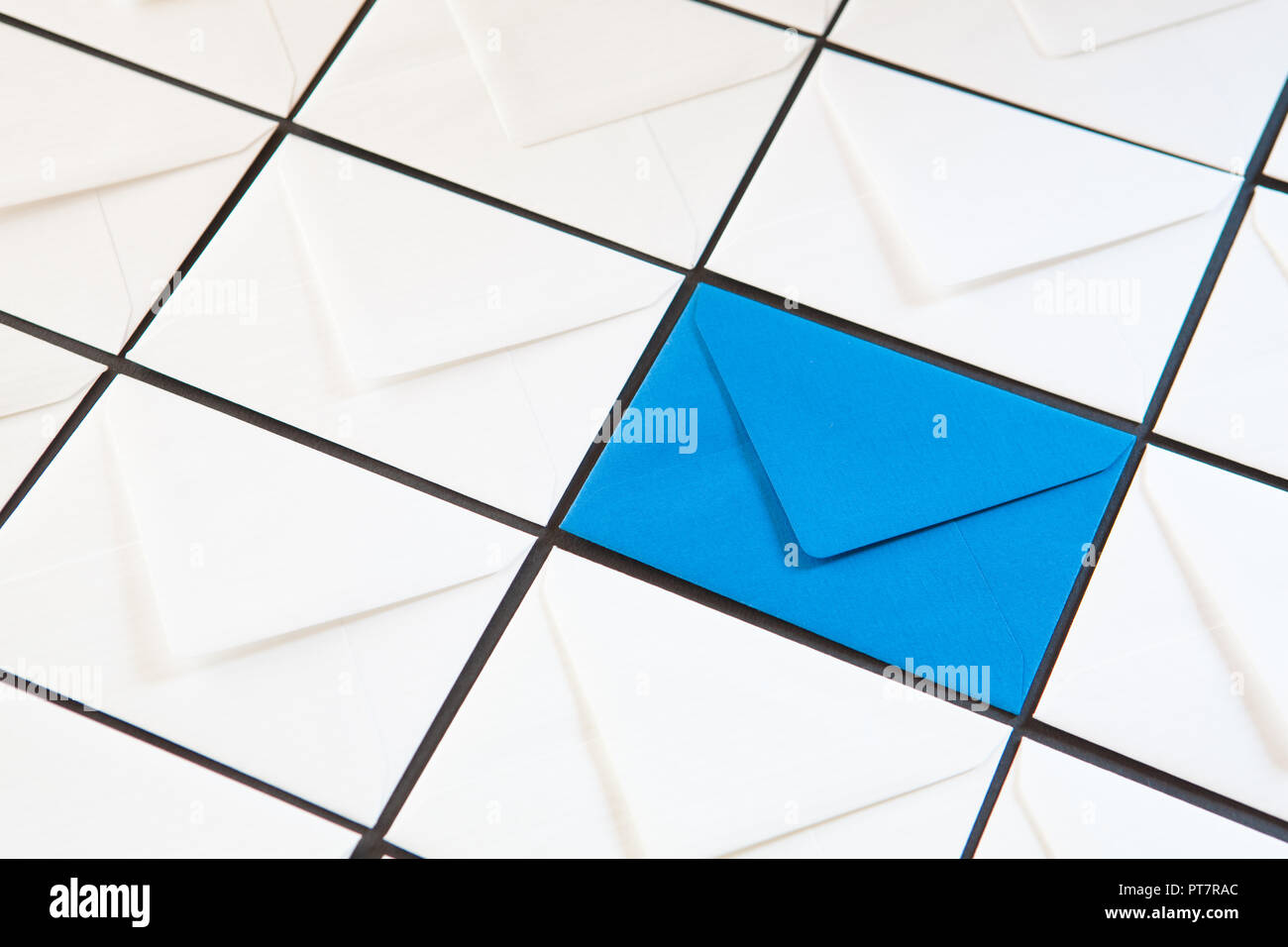 Composition with white and blue envelopes on the table. Different colored envelopes on the table. Stock Photo