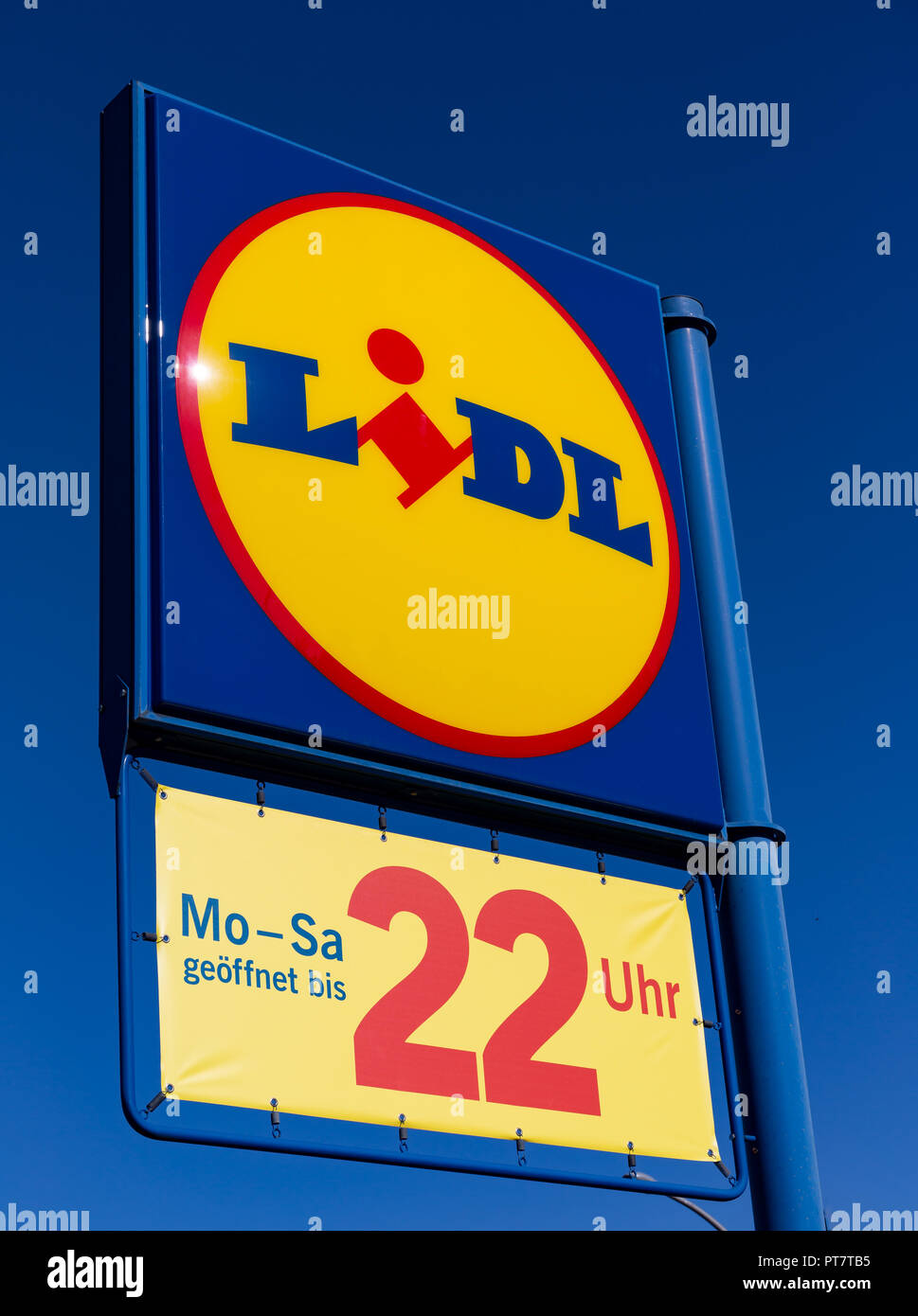 Ruesselsheim, Germany, September 30th. 2018 - Lidl promotion sign on blue sky with opening times Stock Photo