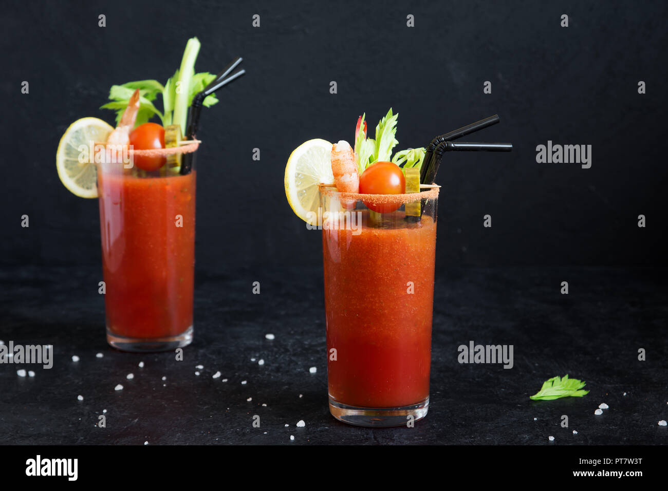 Bloody Mary Cocktail in glasses with garnishes. Tomato Bloody Mary
